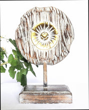 Table Decoration. Decorative hand carved wooden floral disc on stand.