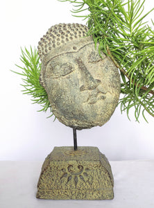 Home Decor: Table - Outdoor Idol.
Sleeping buddha head sculpture on a floral base in stone.