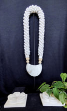 Home Decor. Mother Of Pearl Crescent Necklace with Shells and Wooden Beads on stand.