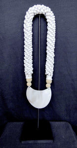 Home Decor. Mother Of Pearl Crescent Necklace with Shells and Wooden Beads on stand.