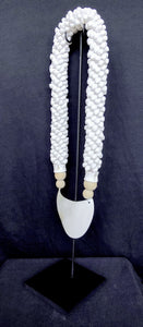 Home Decor. Mother Of Pearl Crescent Necklace with Shells and Wooden Beads on stand.