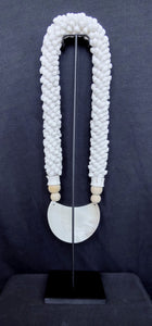 Home Decor. Mother Of Pearl Crescent Necklace with Shells and Wooden Beads on stand.