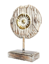 Table Decoration. Decorative hand carved wooden floral disc on stand.