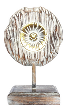 Table Decoration. Decorative hand carved wooden floral disc on stand.