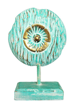 Table Decoration. Decorative hand carved wooden floral disc on stand.