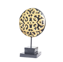 TABLE DECOR: Floral inspired beautiful Asian carved wooden disc mounted on a stand.