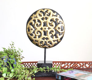 TABLE DECOR: Floral inspired beautiful Asian carved wooden disc mounted on a stand.