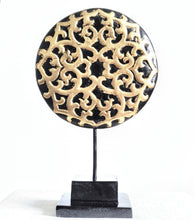 TABLE DECOR: Floral inspired beautiful Asian carved wooden disc mounted on a stand.