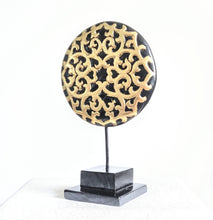 TABLE DECOR: Floral inspired beautiful Asian carved wooden disc mounted on a stand.