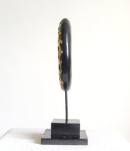 TABLE DECOR: Floral inspired beautiful Asian carved wooden disc mounted on a stand.