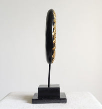 TABLE DECOR: Floral inspired beautiful Asian carved wooden disc mounted on a stand.