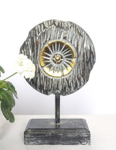 Table Decoration.
Decorative hand carved wooden floral disc on stand.