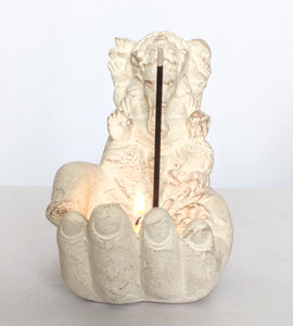 Home Decor. Candle - Incense stick holder. Lord Ganesha seated on a hand in stone.