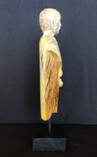 Home Decor.
Contemporary Serene Buddhist Monk Wooden Statue mounted on a rustic wooden base.