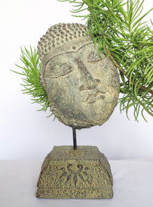 Home Decor: Table - Outdoor Idol.
Sleeping buddha head sculpture on a floral base in stone.